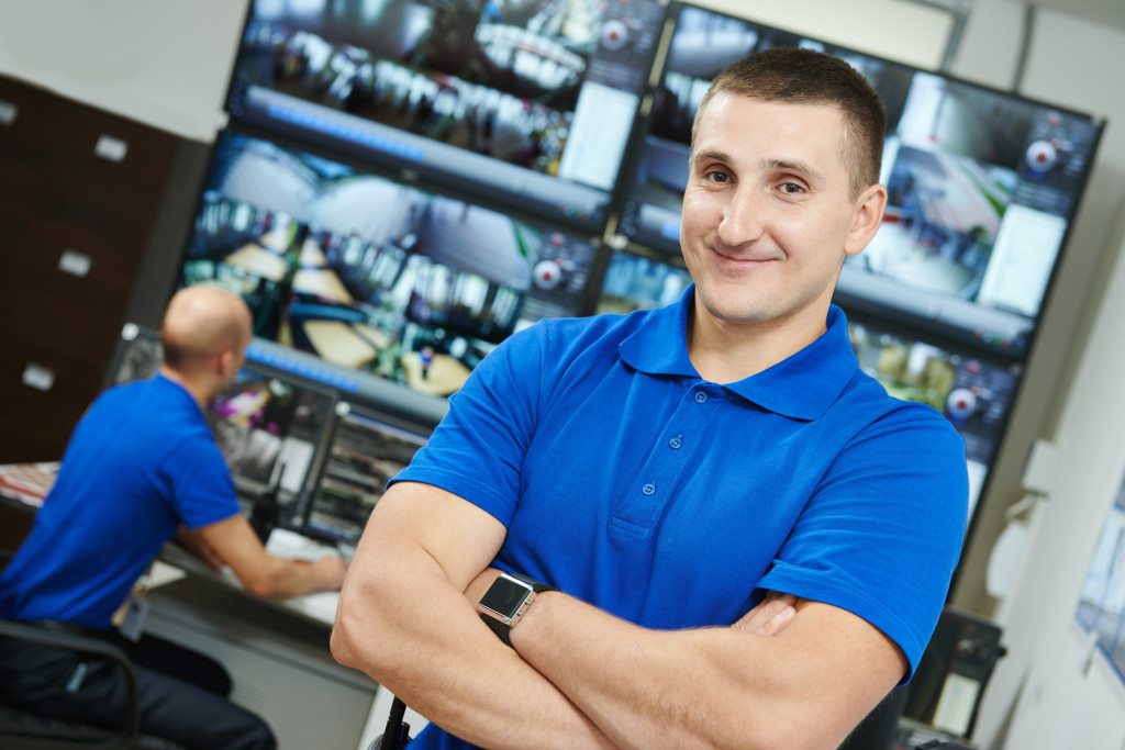 security executive chief in front of video monitoring surveillance security system